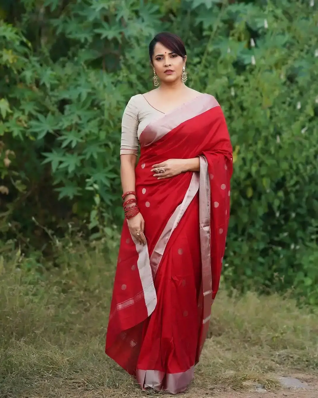 Anasuya Bharadwaj Jewellery Bangles Earrings Red Saree